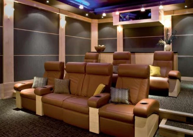 Large television and media equipment in a modern home entertainment room